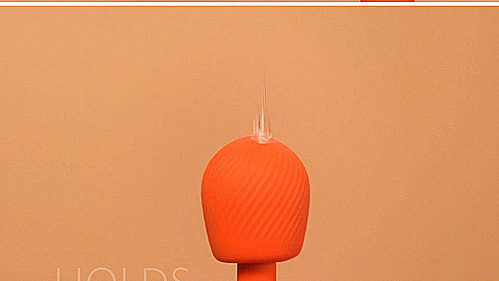 A GIF with a close-up on the head of the wand massager. A person drizzles lube messily onto the top of the wand massager. The text on the GIF reads "Holds lube" | Kinkly Shop