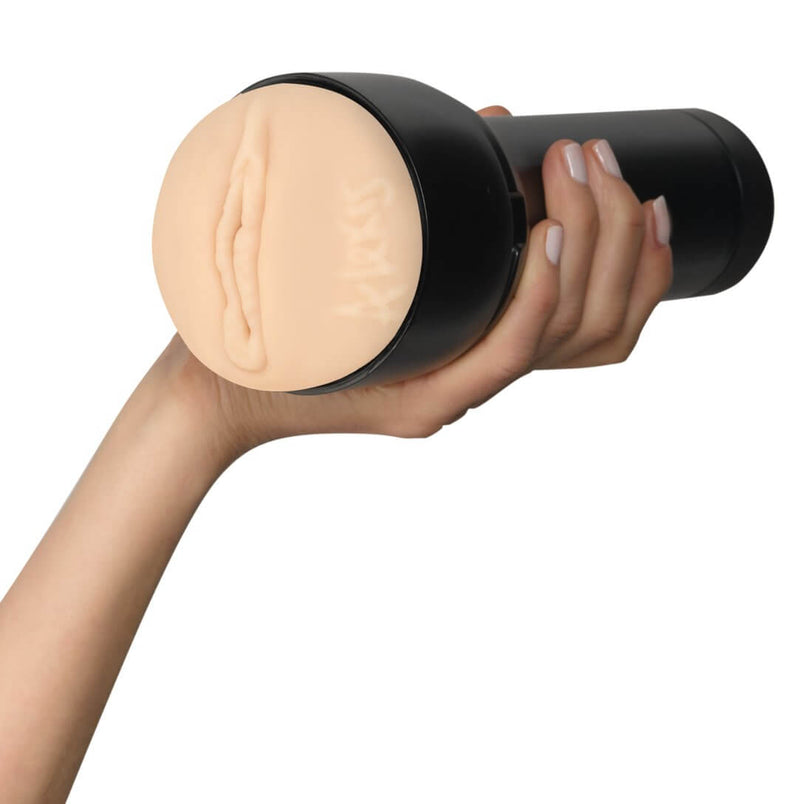A hand holds the black case of the KIIROO FeelStars FeelAlexis Stroker. The hand wraps comfortably around the handle of the stroker. | Kinkly Shop