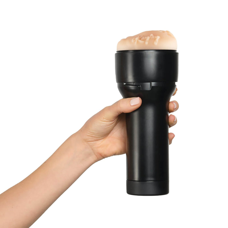 A hand holds the KIIROO FeelStars FeelKayley Stroker. The case looks like it fits comfortably within the person's hand. | Kinkly Shop