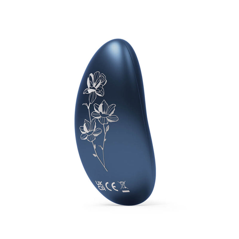 The backside of the LELO NEA 3 in Alien Blue. It's a deep, jewel blue. The backside has floral designs etched to it in an ivory color. | Kinkly Shop