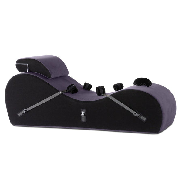 The Liberator Black Label Lyza Lounger Valkyrie in Aubergine purple up against a white background. The headrest and cuffs and blindfold are all shown alongside the shape itself. | Kinkly Shop