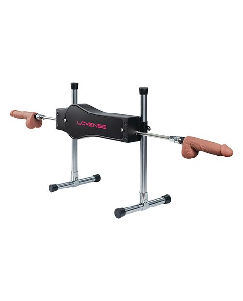 The Lovense Sex Machine in front of a white background shown with both rods and dildos attached to both sides of the machine. It could thrust into two different people at once. | Kinkly Shop