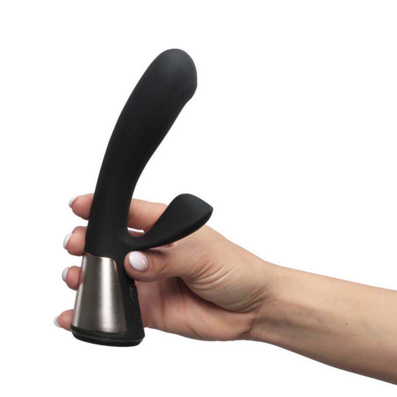 A hand holds the base of the OhMiBod Fuse. It looks like it fits really comfortably into the person's hand while they're holding it. | Kinkly Shop