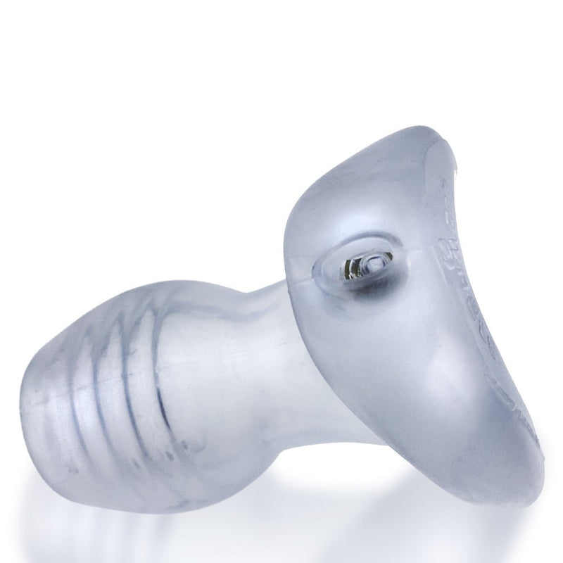 The Oxballs Glowhole with a focus on the base where the LED light sits. The light sits recessed into the toy, away from all of the lube and mess that play may provide. | Kinkly Shop