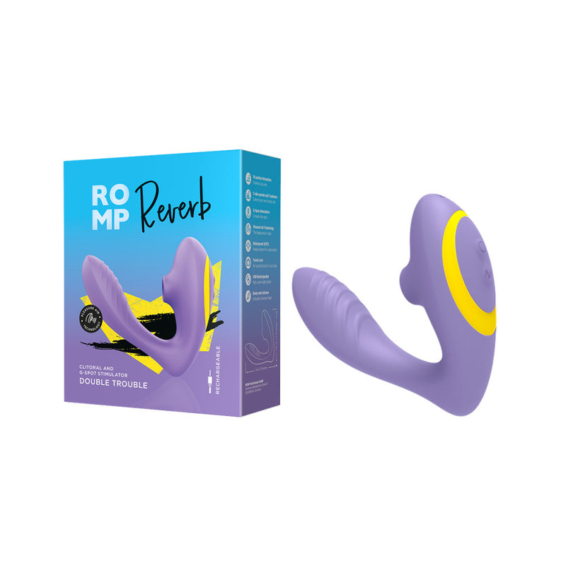 The ROMP Reverb up against a white background, displayed next to its packaging. The packaging is purple and blue, and it color matches the vibrator. | Kinkly Shop