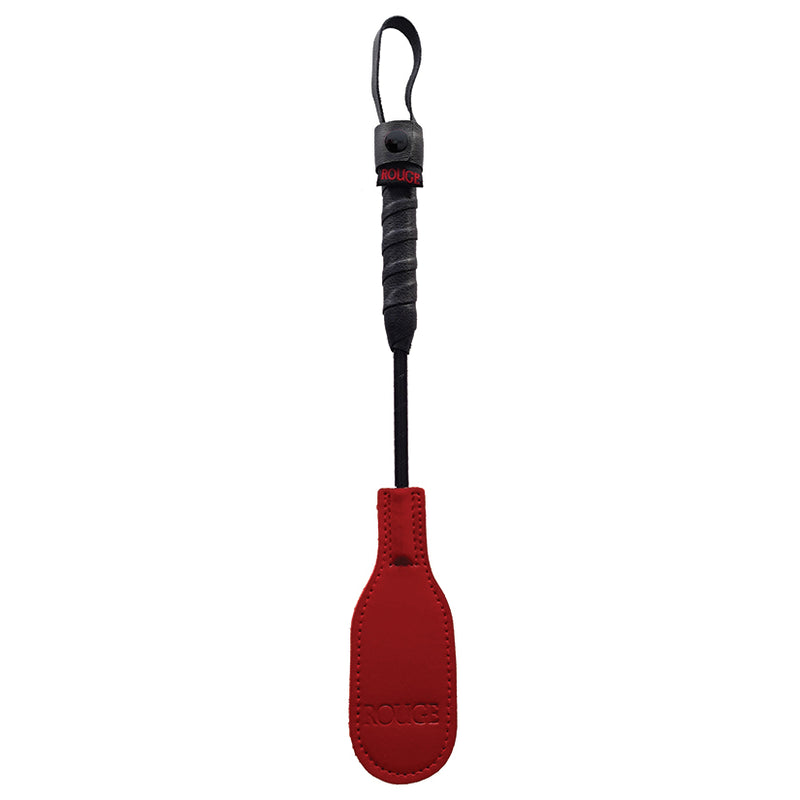 Rouge Leather Mini Oval Riding Crop in red up against a plain white background | Kinkly Shop