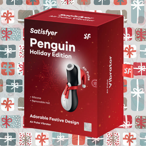 Packaging for the Satifyer Pro Penguin Holiday Edition  in front of a holiday gifting wallpaper. The box is a bright red that looks perfect for the holidays. | Kinkly Shop