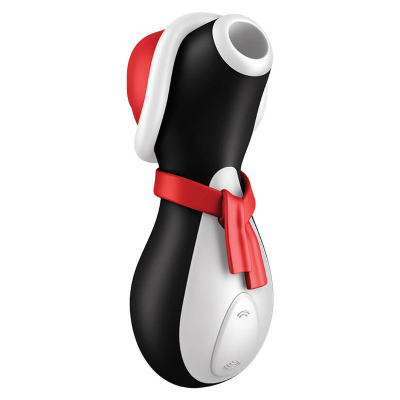 Satifyer Pro Penguin Holiday Edition in front of a plain white background. The sex toy has a removable Santa hat and removable red scarf. | Kinkly Shop