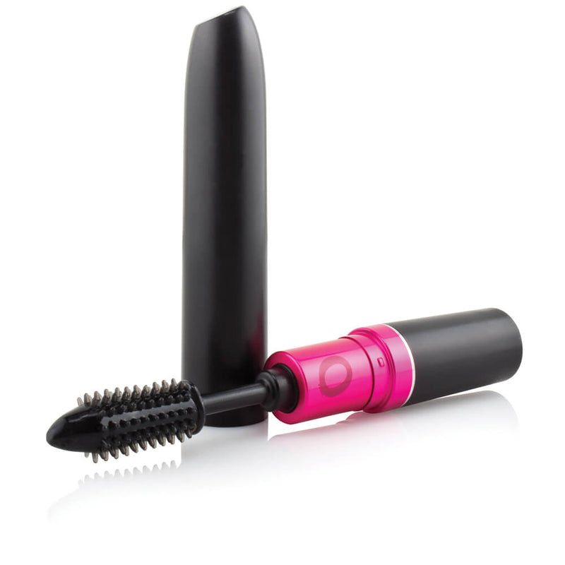 The Screaming O My Secret Vibrating Mascara sitting out. The tip of the vibrator is near the camera, showcasing the flexible, textured tip of the "mascara brush". The cap for the toy is sitting out near the vibrator's handle. | Kinkly Shop