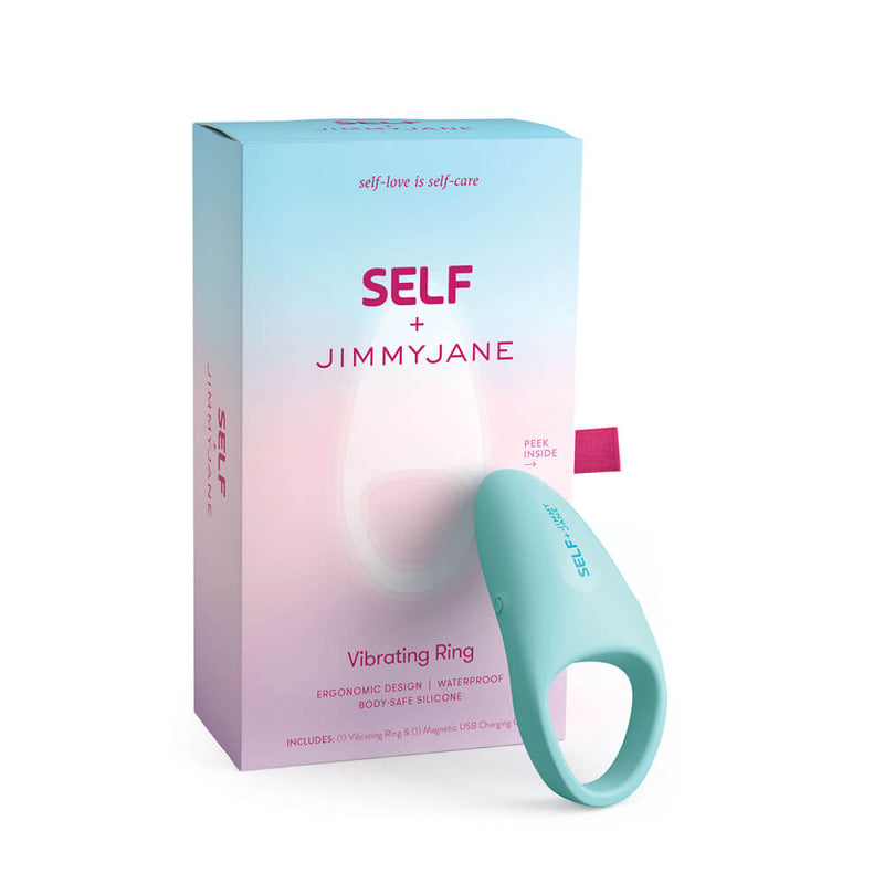 The SELF + Jimmyjane Vibrating C-Ring resting up against the packaging that the cock ring comes in. | Kinkly Shop