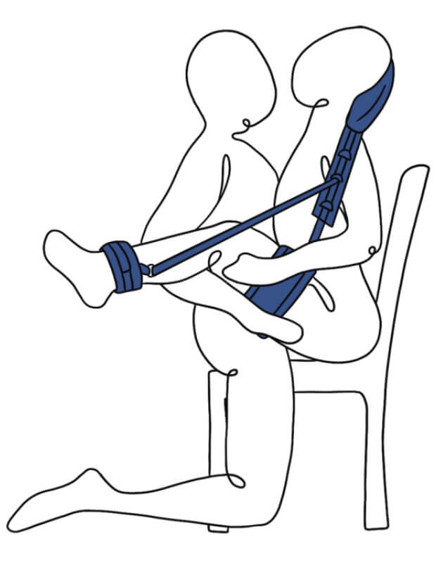 Illustration shows the Sportsheets Pivot Positioning Partner in use. The receiving partner is sitting in a chair. The Sportsheets Pivot Positioning Partner is behind their back and supporting the ankles and thighs to lift up both legs while sitting in the chair. The penetrating partner then straddles the chair as well, achieving intercourse with the receiver's legs moved out of the way. | Kinkly Shop