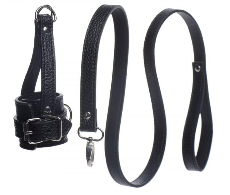Both the Strict Ball Stretcher with Leash sit next to one another, unattached. This showcases how both straps of the Ball Stretcher come together for a single "D-ring" that the leash can be clipped onto. Since the two items come apart, this same design allows the Ball Stretcher to hang weights from it as well. | Kinkly Shop
