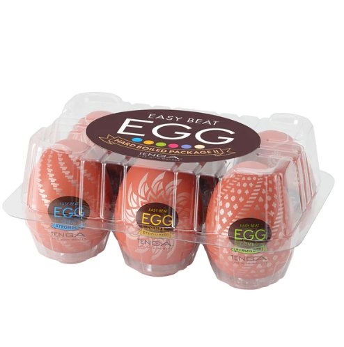 Tenga Egg Hard Boiled 2 variety pack. Six rusty-red Tenga Eggs are contained within a see-through plastic egg carton. | Kinkly Shop