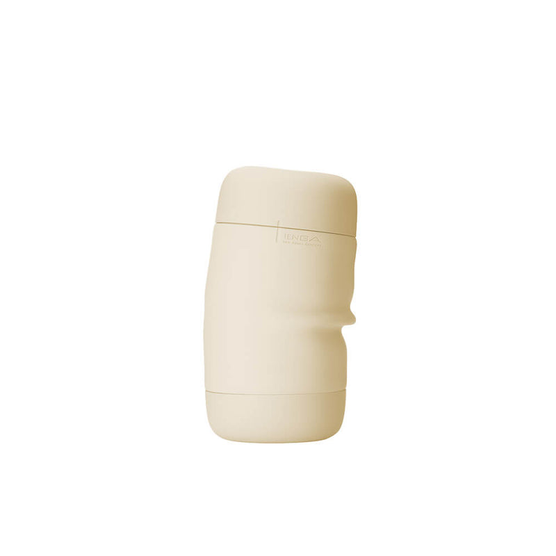 The Tenga Puffy in latte brown shown slightly compressed with the gentle, flexible silicone external case bending uner the pressure because of the flexible design. | Kinkly Shop