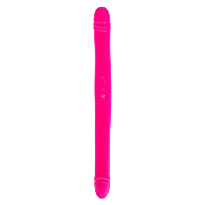 The Together Toy Duo Together, face up, laid out flat. The dildo looks really long, and the control buttons can be seen near the centerpoint of the shaft of the toy. The Together Toy Duo Together is a very bright, vibrant pink color. | Kinkly Shop