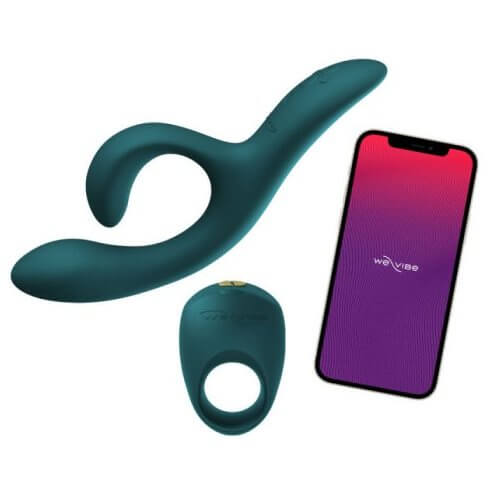 The We-Vibe Nova 2 and the We-Vibe Pivot laying out next to a cell phone that has the app open on it. | Kinkly Shop