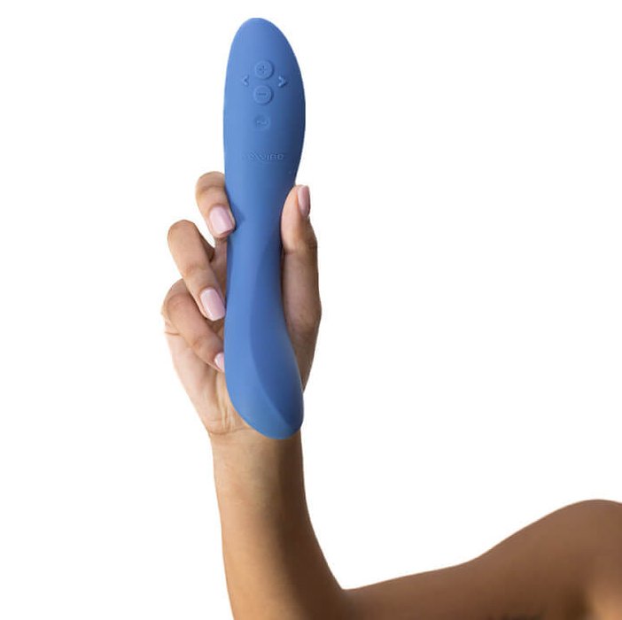 A person's hand and arm are up against a white background, holding the We-Vibe Rave 2 to the camera. The toy is slimmer than the person's forearm, but it's slightly longer than the person's outstretched hand. | Kinkly Shop