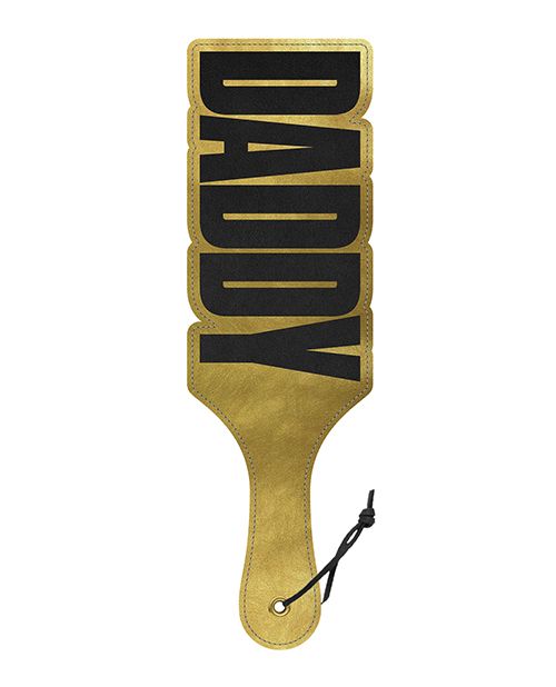 Front side of the Wood Rocket Daddy Paddle. The paddle is a shiny, shimmery gold except for the words "DADDY" which are written in large, bold letters throughout the entire paddle. | Kinkly Shop