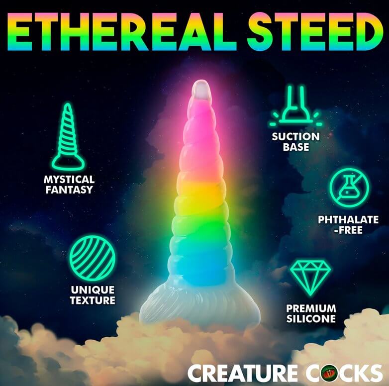 The Creature Cocks Uni Glow dildo in front of a dark, celestrial background. It glows from the glow-in-the-dark pigment. Text and features are showcased around the toy. Text on the image reads: "Ethereal steed. Mystical fantasy. Unique texture. Suction base. Phthalate-free. Premium silicone." | Kinkly Shop