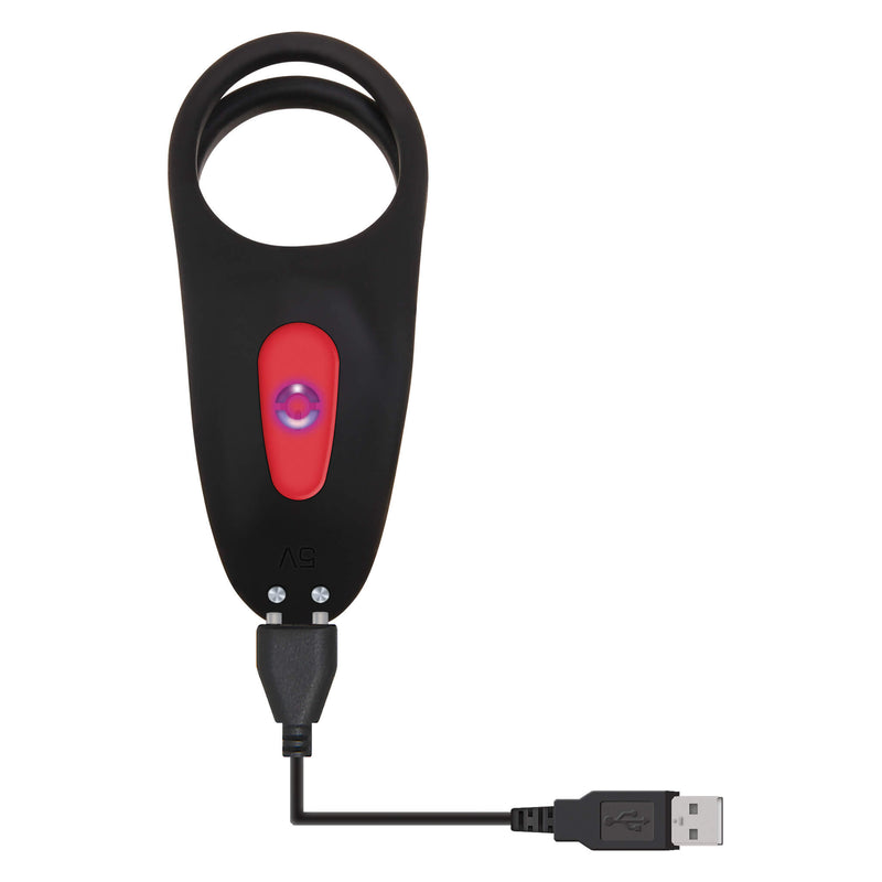 The base of the vibrator. The charging cable is shown connected to the two magnetic charging prongs at the base of the vibrator. The other end of the charging cable is a USB that can plug into any standard USB port. | Kinkly Shop