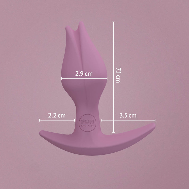 Fun Factory Bootie Fem up against a purple background with all of the images of the butt plug superimposed over the image. The plug is 2.9cm at the widest point, and it has an insertable length of 7.1cm. The longer base end is 3.5cm in length while the shorter base end (designed to face the vaginal opening during use) is only 2.2cm. | Kinkly Shop