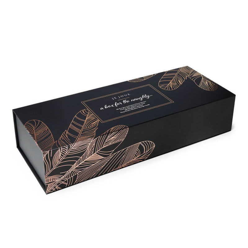 The Je Joue Naughty Collection gift box while it's fully closed. The black box now has beautiful, feather outlines in rose gold on the outside of it. | Kinkly Shop