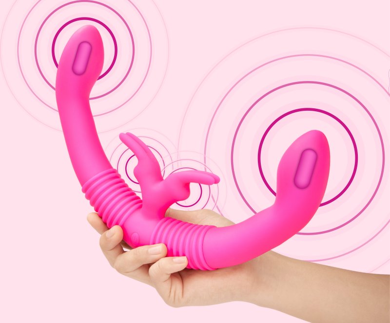 A person holds the Together Toy Shared Vibrator for Couples while drawn-in circles show all of the vibration points vibrating | Kinkly Shop