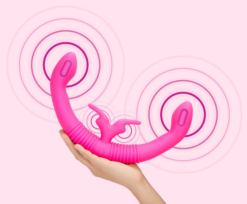 A person holds the Together Toy Shared Vibrator for Couples while the vibrator vibrates | Kinkly Shop