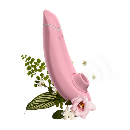 Womanizer Premium Eco Friendly Vibrator surrounded by illustrated greenery | Kinkly Shop