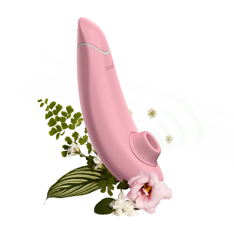 Womanizer Premium Eco Friendly Vibrator surrounded by illustrated greenery | Kinkly Shop