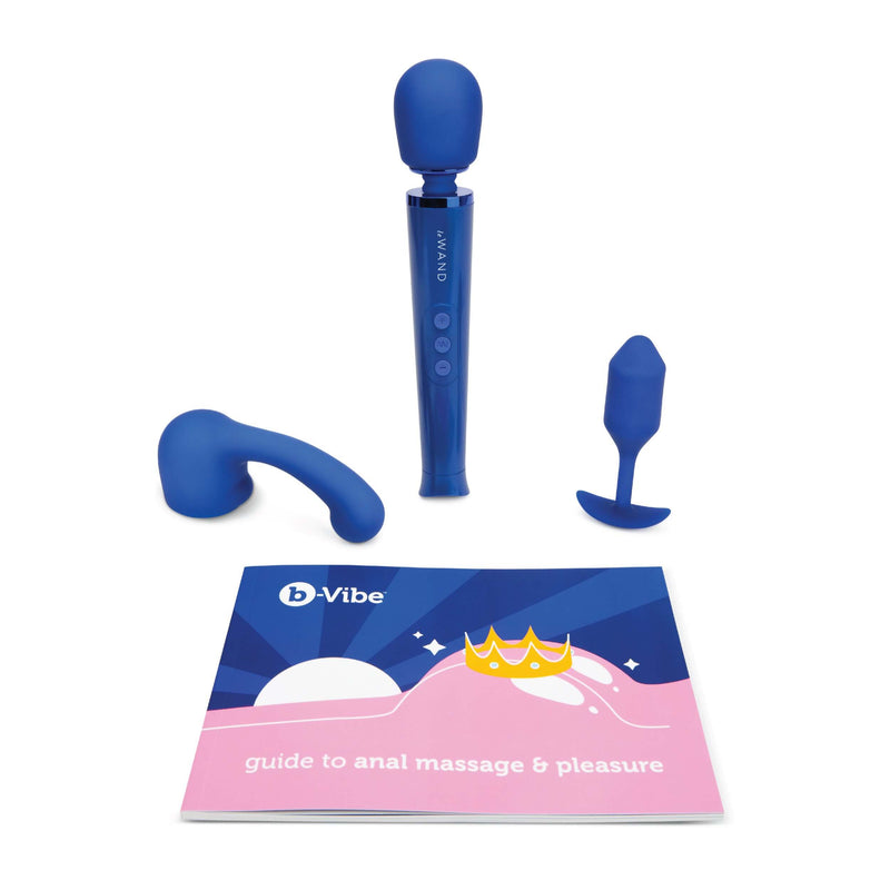 The toys of the b-Vibe Anal Massage Set sitting out in front of a white background. There's the wand massager attachment, the wand massager, the b-Vibe Snug plug, and the Guide to Anal Massage and Pleasure booklet. | Kinkly Shop