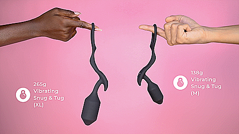 GIF of both sizes of the b-Vibe Vibrating Snug and Tug. Hands are in the frame from both the right and left side. The heavier, larger Extra-Large is on the left side while the lighter Medium is on the right. The GIF's text says the extra-large is 265g while the Medium is 138g. | Kinkly Shop