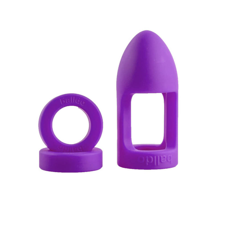 The Balldo in Purple next to its two spacer rings. Drops of water are on the surface of the toy. | Kinkly Shop