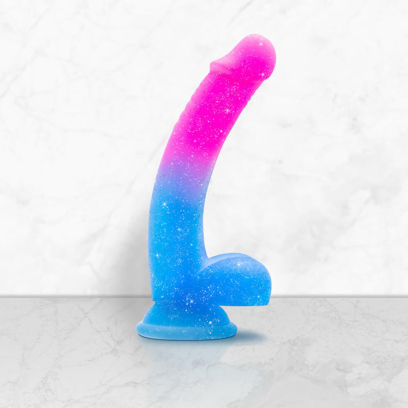 Blush Avant Chasing Sunsets dildo up against a marbled background. The dildo looks very long and thin. | Kinkly Shop
