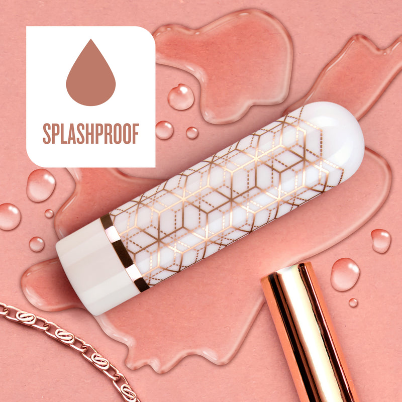 Blush Glitzy gold bullet vibrator sitting in a puddle of water to display its splashproof capabilities | Kinkly Shop