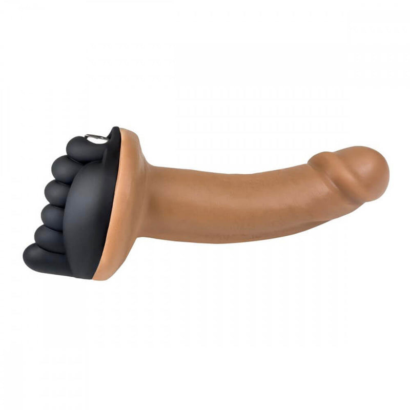 The Honeybunch Dildo Base Attachment for Pegging Pleasure in Black pressed up against a dildo. The image shows it at a side-view to show how it attaches to a dildo. The image shows how deeply the texture of the Honeybunch goes between the labia. | Kinkly Shop