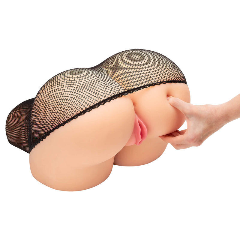 A person is reaching out and pinching the butt of the Cloud 9 Life-Size Portable Sex Doll while it wears the fishnet stocking. This shows how squishy the butt is. | Kinkly Shop