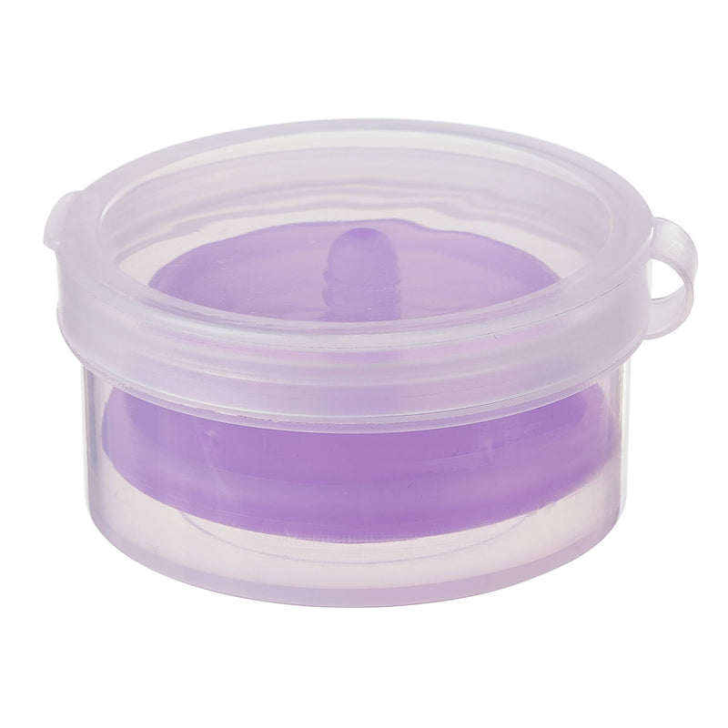 Compressed travel period cup from the Cloud 9 Reusable Menstrual Cups kit sitting inside of its case. | Kinkly Shop