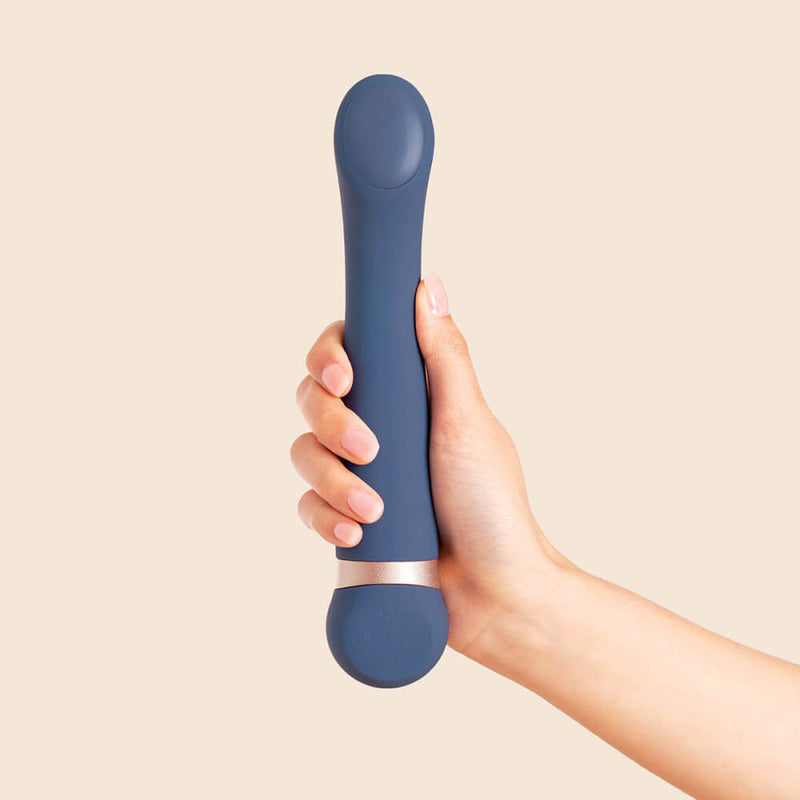 A hand holds the Deia Hot & Cold Temperature Play Vibrator. The vibrator is clearly longer than the person's hand. | Kinkly Shop