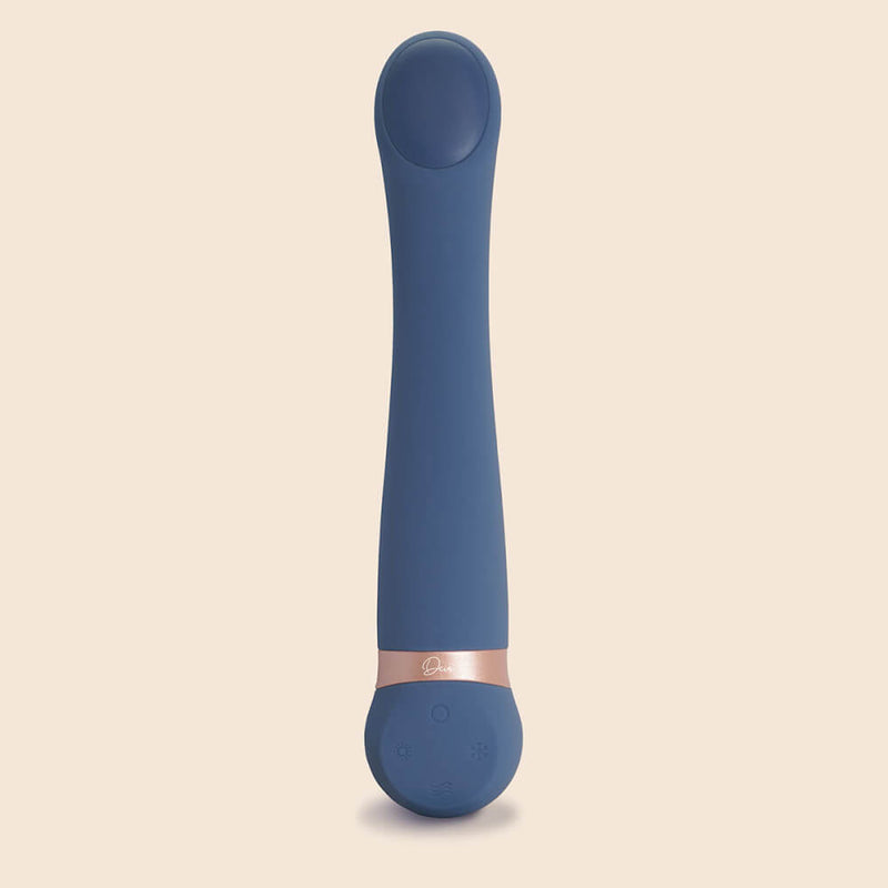 The Deia Hot & Cold Temperature Play Vibrator up against a plain background. From this angle, the different, shinier, plastic-like material of the temperature play tip can be seen. The differences in diameters between the thicker head and slimmer shaft can also be seen. | Kinkly Shop