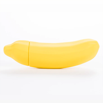 The Emojibator Banana in front of a plain white background. It has a very light curve to it with a decent girth. | Kinkly Shop