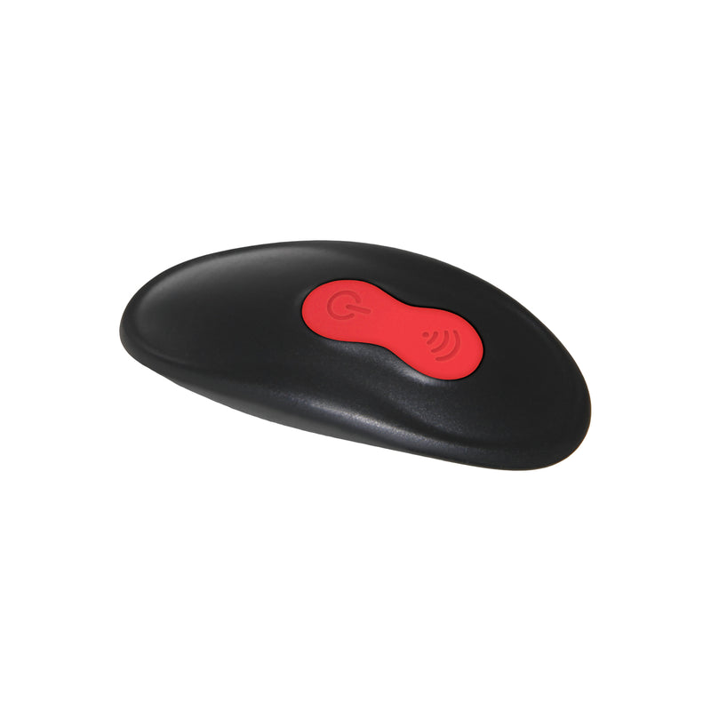 A close-up of the penis extension remote control that shows the two buttons on the remote for the Zero Tolerance Vibrating Girth Enhancer Extension. There is a Power button and a Modes button. | Kinkly Shop