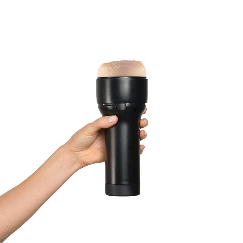 A hand holds the KIIROO FeelStars FeelLauren Stroker. The hand curls comfortably around the handle of the stroker. | Kinkly Shop