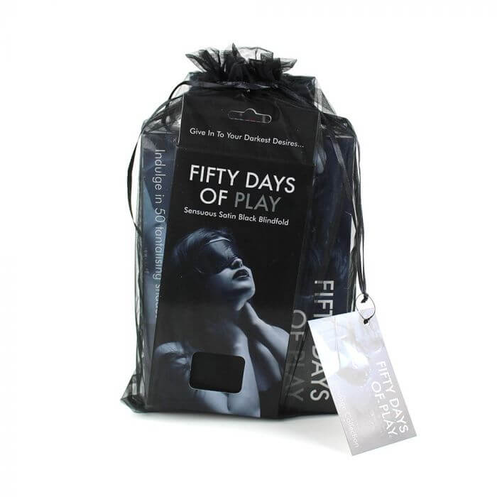Packaging for the full bondage bundle of Fifty Days of Play Bondage Bundle. It includes the game itself, the cuffs, and the box for the blindfold all in a mesh, drawstring bag that packages them all together. | Kinkly Shop