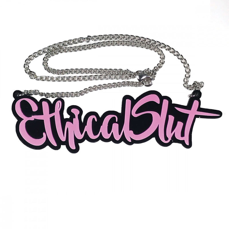 Close-up of the acrylic design of the Geeky & Kinky Ethical Slut Necklace | Kinkly Shop