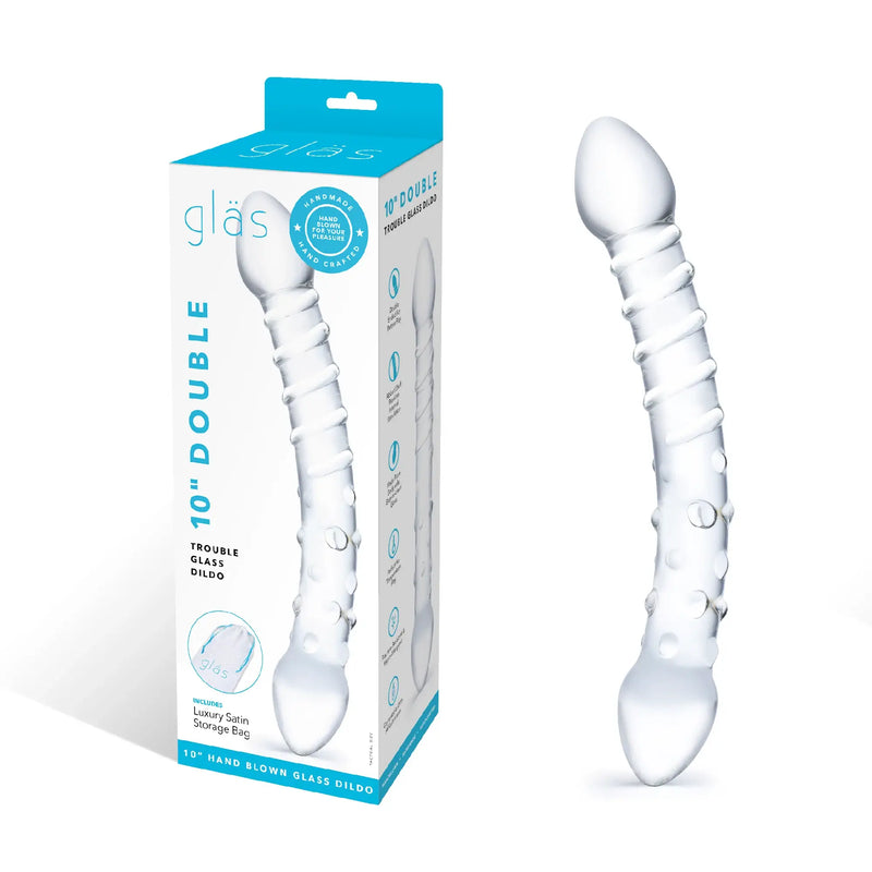 The Double Trouble Glass Dildo sits out next to the packaging for the Double Trouble Glass Dildo | Kinkly Shop