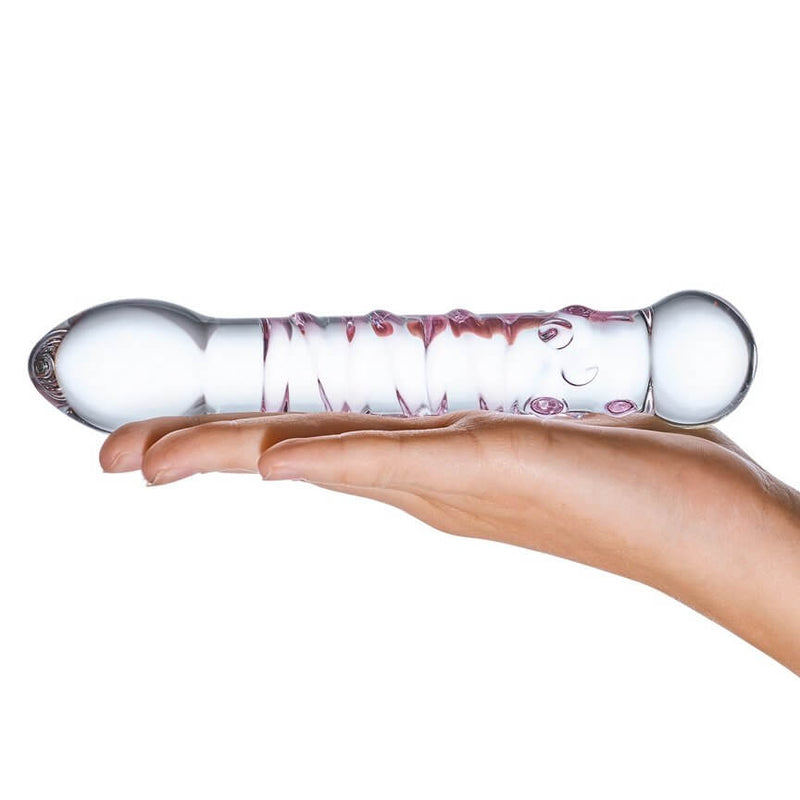 A open, flat palm presents the Spiral Staircase glass dildo on top of it. The dildo is noticeably thicker than a finger, and it's slightly longer than the hand that presents it. | Kinkly Shop