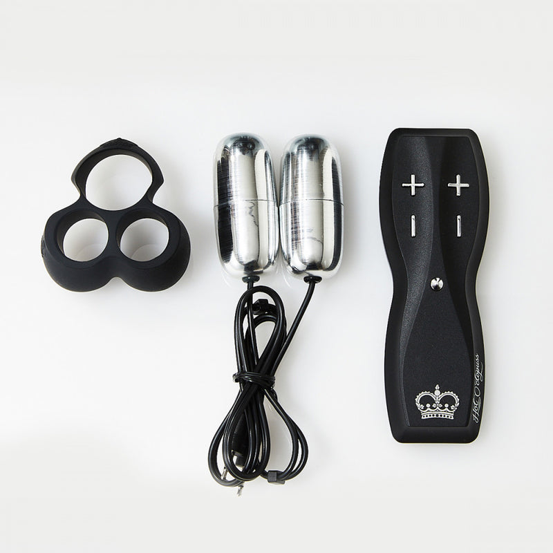 A lay flat image showing the Hot Octopuss Jett in its multiple pieces: a silicone cock ring, two bullet vibrators, and the bullet vibrator remote control | Kinkly Shop