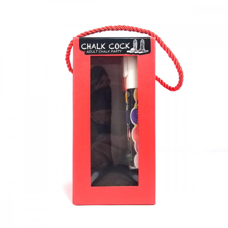 The Chalk Cock Adult Chalk Party toy inside of its packaging. It comes in a plain red box with a see-through panel that showcases the Chalk Cock and chalk markers inside. | Kinkly Shop