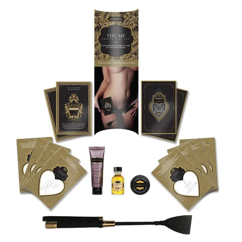 Everything included in the Kama Sutra Feel Me Kit laid out against a white background. It includes all of the cards, the packaging, the sensual products, and the riding crop. | Kinkly Shop